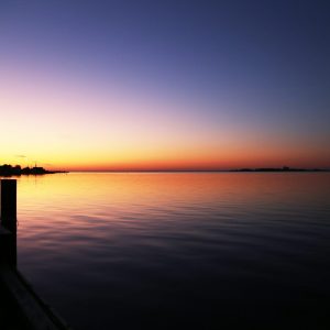 Waking up to the vibrant sunrise colors of the Great South Bay in Massapequa, Long Island.