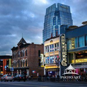 The city street of downtown Nashville as the sun sets and the lights come on. Nashville Tennessee.