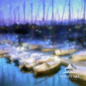 Boats docked in the harbor at Port du Crouesty, Brittany, France during the blue hour.