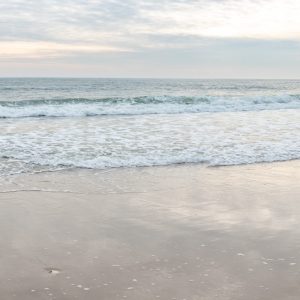 Overlooking the Atlantic Ocean with soft coloring in the sky. Hints of cloud reflections are in the