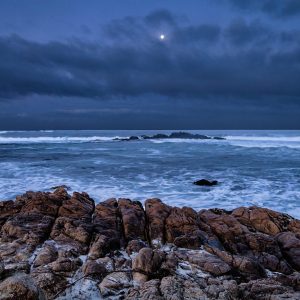 Just after dawn, the moon set over the Pacific Ocean near Pebble Beach, California on the Monterey