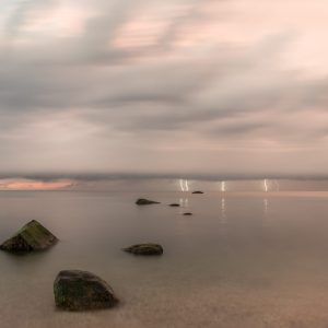 Rocks, Sky, Water.
Lightning from a storm too far away to be heard.