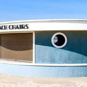 It a wash of ocean blues and sandy hues, the umbrella and chair concession structure at Jones Beach