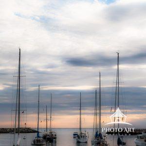 Harbor Glass (Glouchester, MA) 37 Sailboats lay relatively still in the harbor in Rockport Massachusetts. The maker's post-processing