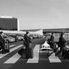 TWA crew 111 Flight Crew crossing over parking lot of TWA Hotel at JFK airport.