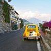 Yellow Fiat 500 – Positano 97 Vintage Fiat 500 parked on side of one of Positano's curvy roads. Amalfi Coast.