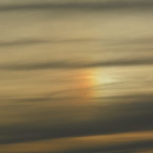 Closeup of a phonomana know as a Sundog which occurs when sunlight is reflected through a cloud or