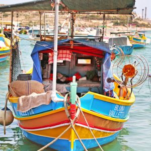 Cozy boat in the Marsaxlokk  Port. Malta.