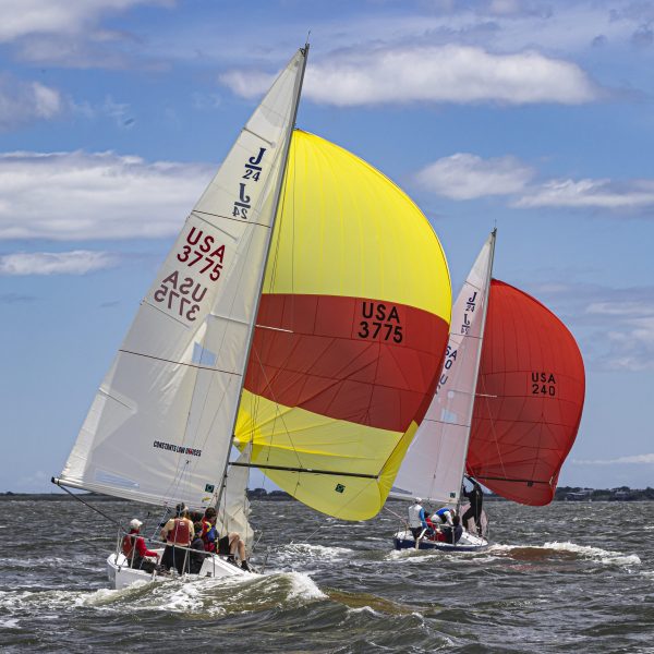 J/24s squaring off their chutes as they head downwind.