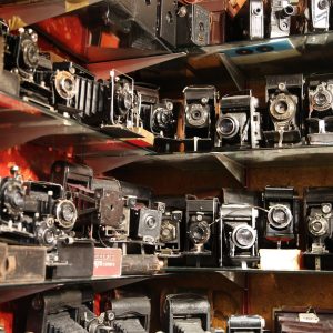 All different types of vintage cameras sitting on shelves at the Portobello market. London, UK