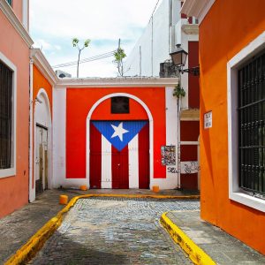The cool Puerto Rican flag at the end of street in Old San Juan, Puerto Rico.