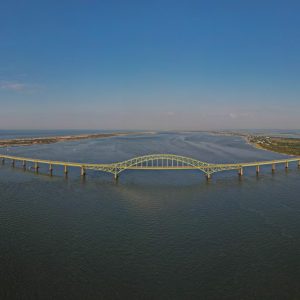A panoramic aerial view of the Rober Moses Bridge bringing people from the south shore to Fire