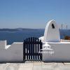 Gate to paradise - Santorini, Greece 20 A blue gate entrance down to beautiful views of the pristine blue waters of Santorini, Greece.