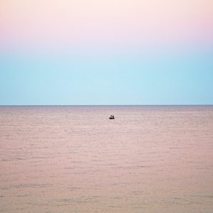 A boat out in the distance, off of Inkwell beach located in Oak Bluffs, Martha's Vineyard.