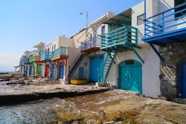Multi-colored houses on the shoreline of seaside village of Klima, Milos. Greece.