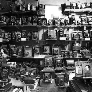 Vintage and antique cameras displayed on various shelves at Portobello Market. London, UK