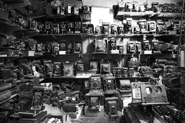 Vintage and antique cameras displayed on various shelves at Portobello Market. London, UK