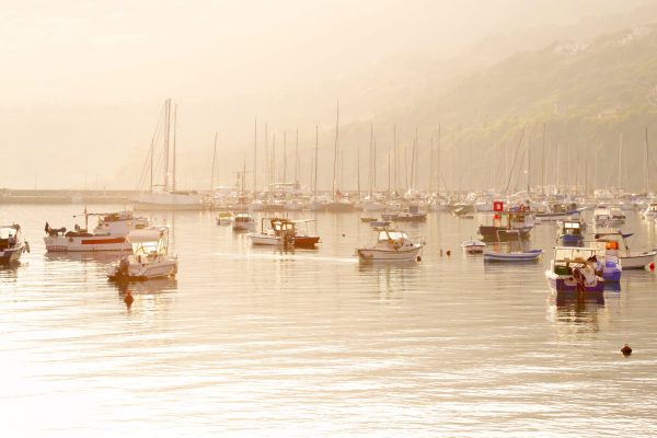 Boats resting in Vibo Valentia Marina, after sunrise. Calabria, Italy.