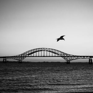 View of the Fire Island Inlet Bridge from Captree State Park. This is a sunset photo but I really