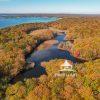 An aerial view of Mashomack Preserve in Shelter Island, NY during the fall foliage season. There