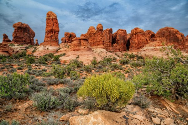 Storm clouds gather over the sandstone formations in Arches National Park, Utah.