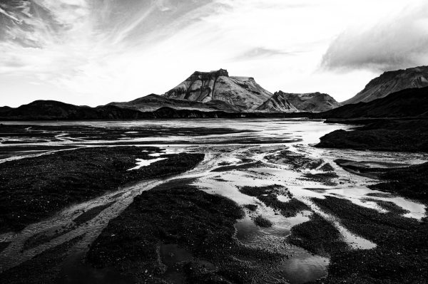 Dramatic black & white view of streams of water from the Mýrdalsjökull Glacier in Iceland