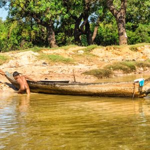 Two young boys from Kampong Phluk "Long-Pole Village" near Tonle Sap Lake in Cambodia struggle