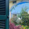 This photograph transports the viewer to a serene and picturesque view onto an intimate garden where