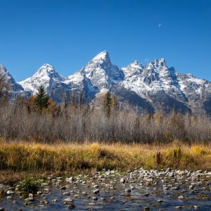 The small rocks in the riverbed represent, to me, the little pieces of the Tetons. The nearly dried
