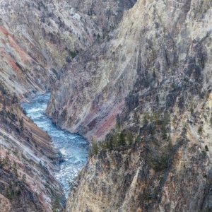 The Yellowstone River looks small in comparison to the towering gorge it runs through. Magnificent