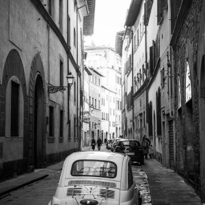 This was captured on a small street in Florence early one morning. The bright sun above, the way