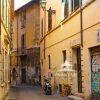 In this photograph, the viewer is transported to a Roman street that encapsulates the harmonious