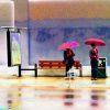 Abstract of 2 ladies with colorful umbrellas.