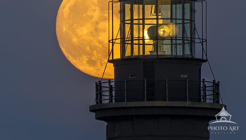 Captured the full moon lighting the inside of the lamp room at Fire Island Lighthouse.