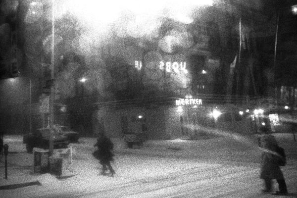 Pedestrians make their way through a snowstorm.