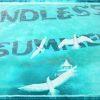 Composite photo of swimming pool inlayed tiles "Endless Summer" and seagulls.