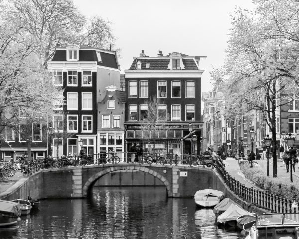 The essence of Amsterdam’s street life, this image blends the historic charm of Dutch canals,