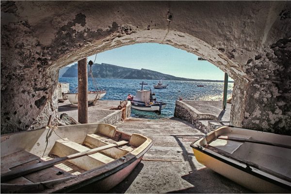 Boats are stored in a natural cave.