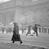 Pedestrians slosh through the snow in front of the NY Public Library.