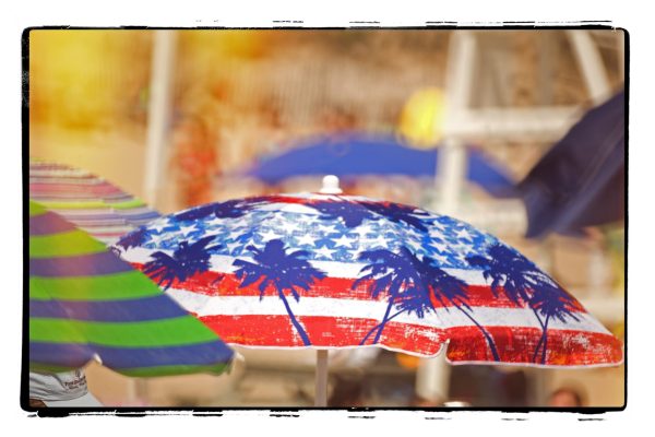 The central focus of this photograph is a colorful umbrella with a design reminiscent of the