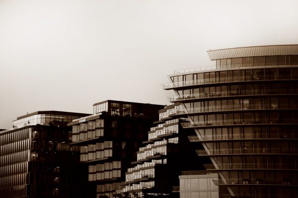 This photograph presents a sepia-toned view of the Wharf in Washington, D.C., where old and new