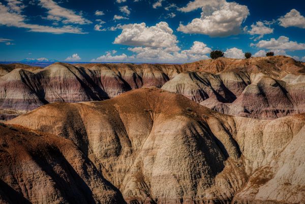 Layers of Time is a striking photograph depicting eroded hills with layers of various hues, rugged