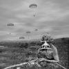 This is a black and white photograph of war games in the US during the Vietnam War . It depicts a