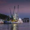 Shrimp boat at dock at sunset. Was photographing the sunset over the bridge, turned, and caught this