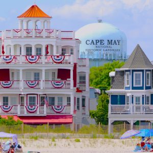 View of Historic Cape May Victorian Houses and Water Tower along the beach. Taken from a boat in