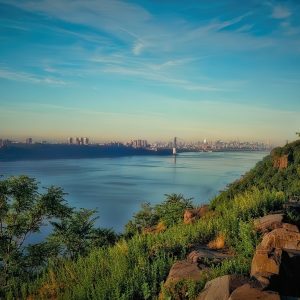 This is a scenic photograph showcasing a beautiful landscape around the Hudson River. It features a