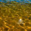 Liking the abstract look of Tahoes surf and sand with all the reflections..