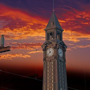 This is a photo of the Hoboken Lackawanna clock tower. It’s shown standing prominently against a
