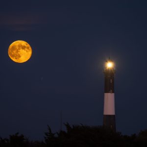Hunter Super Moon rise behind the Fire Island Lighthouse.