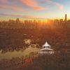 This photograph captures a vibrant, panoramic view of a sunrise behind the the east side of
